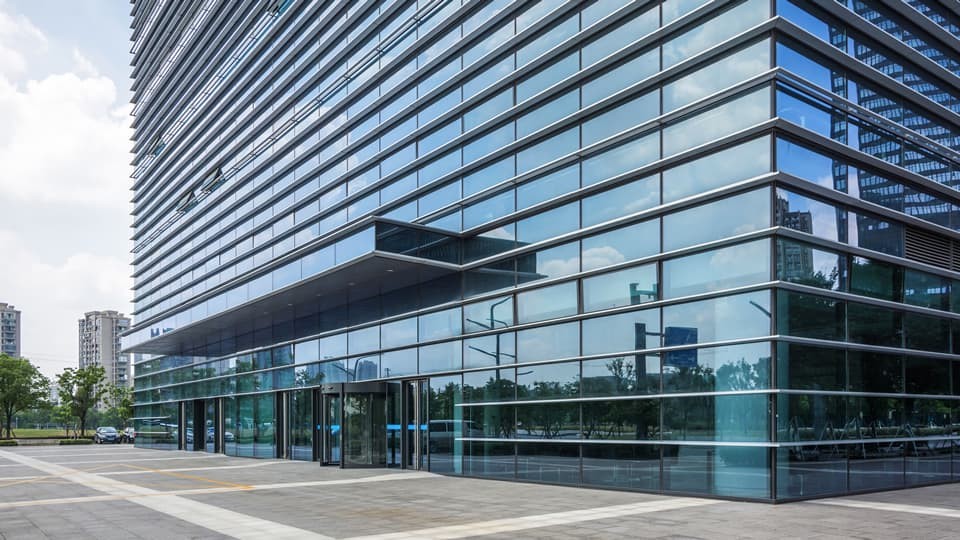 Side view of the front of a modern high rise office building